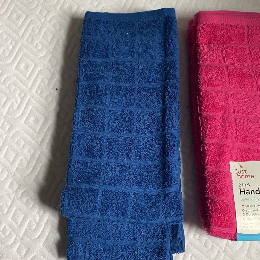 NWT two sets of 2 hand towels in navy and pink! 100% cotton! Smoke/pet FREE Home